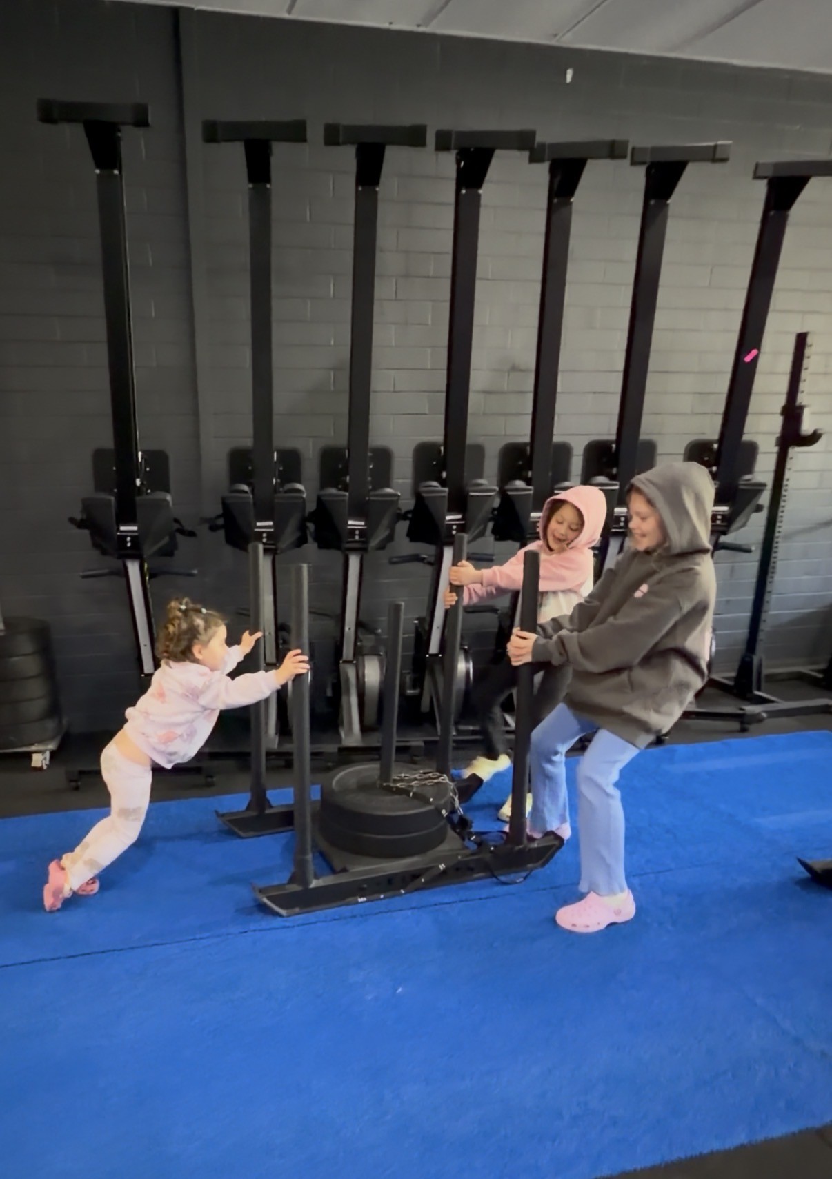Kids having a go on the sled at Grandstand CrossFit Perth